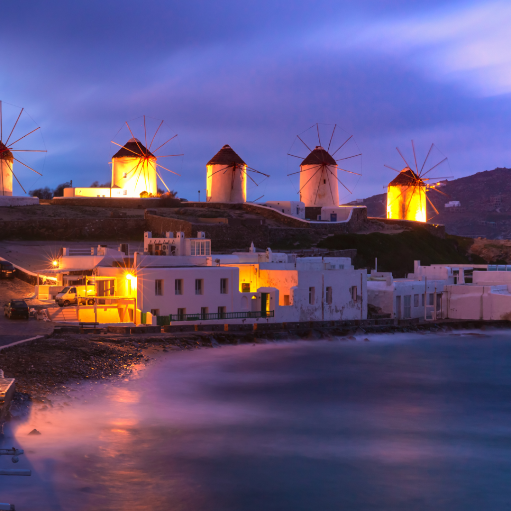 Mykonos windmills at sunset overlooking the Aegean Sea